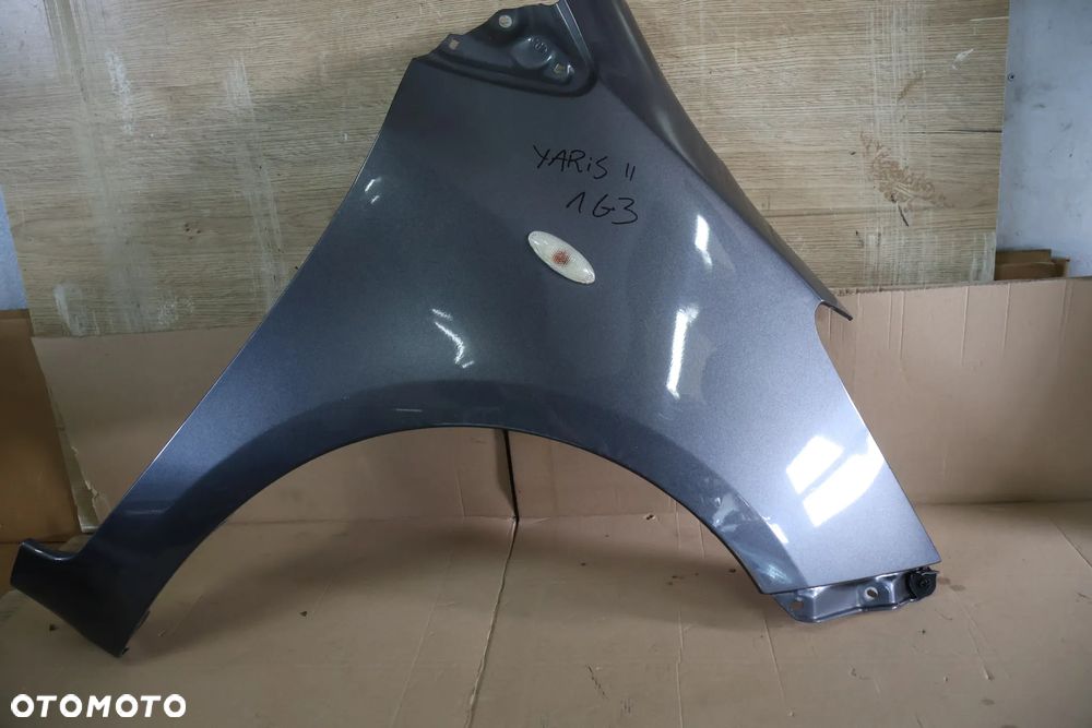 TOYOTA YARIS II 2 06-11 BŁOTNIK PRAWY PRZÓD PRZEDNI 1G3