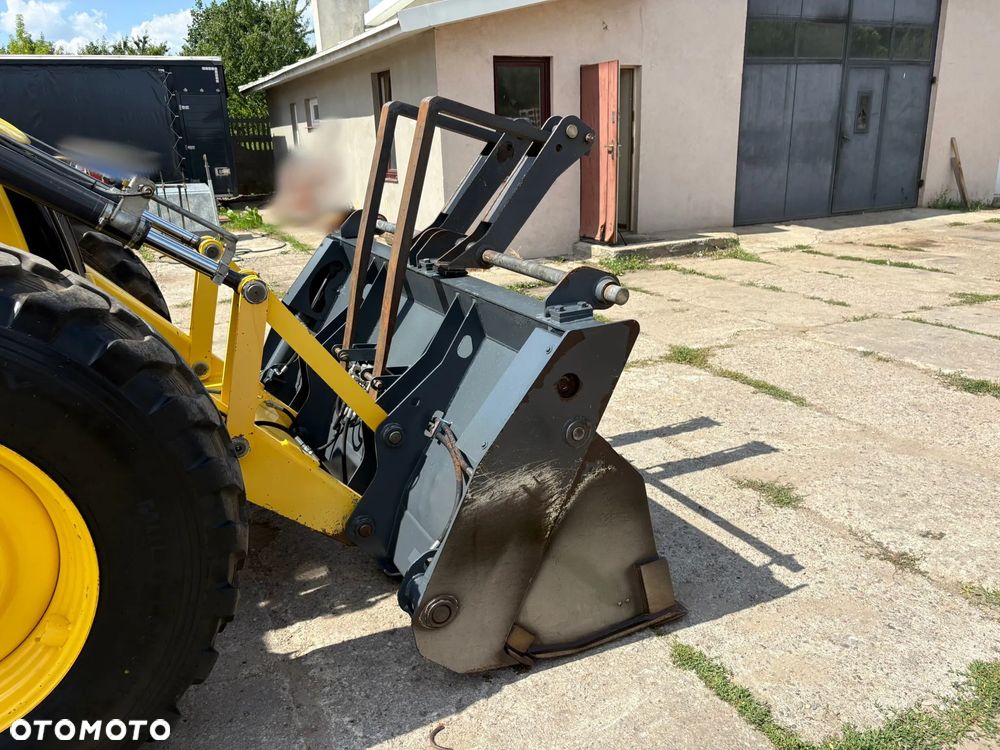 New Holland B115C - 25
