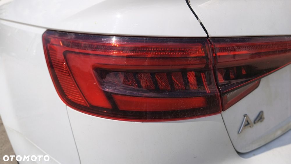 AUDI A4 B9 18r SEDAN LAMPA W BŁOTNIK LEWY TYŁ LED - 1