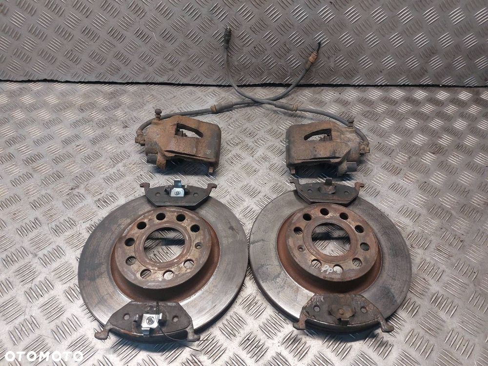 TARCZE HAMULCOWE PRZÓD + KLOCKI + ZACISKI SKODA OCTAVIA II LIFT 1.9 TDI - 1