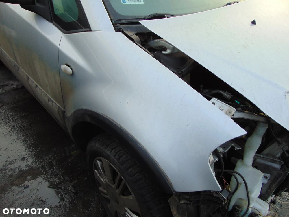 BŁOTNIK PRAWY PRZÓD PRZEDNI SUZUKI SX4 SEDICI ZCC Z LISTWĄ - 1