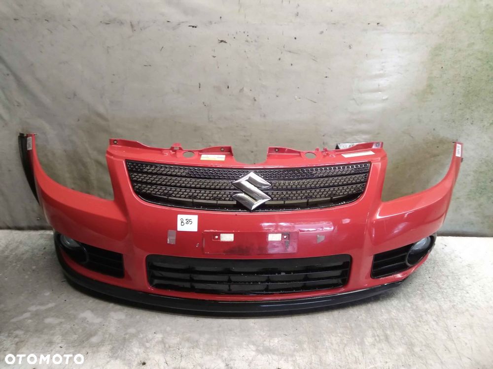 ^ ZDERZAK PRZÓD PRZEDNI DO SUZUKI SX4 ZCF CZERWONY HALOGENY - 1