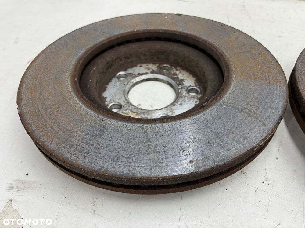 Tarcze hamulcowe Volvo C30 C70 S40 V40 V50 Ford C-max MK1 Focus MK2 Kuga 03-12r. przednie 300mm. KPL - 7