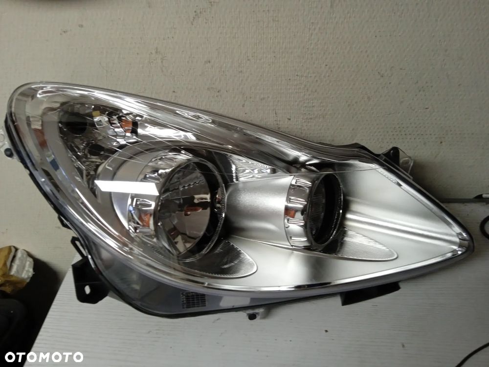 REFLEKTOR OPEL CORSA D LEWY LUB PRAWY NOWY - 7