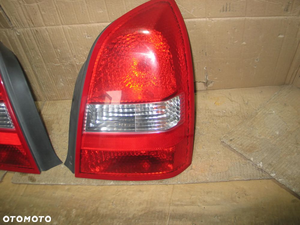 lampa tyl prawa lewa nissan primera P12 sedan oryginal - 6