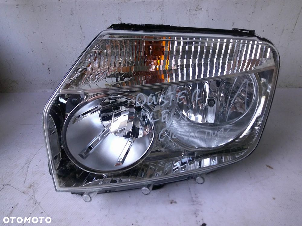 dacia duster i 1 lampa przód lewa nowa oryginał z uszk - 1