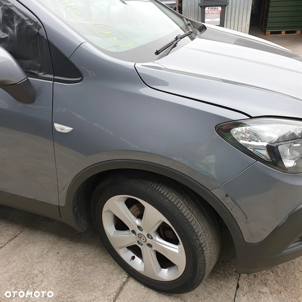 OPEL MOKKA  BLOTNIK PRAWY LISTWA PRZOD GYM 15R