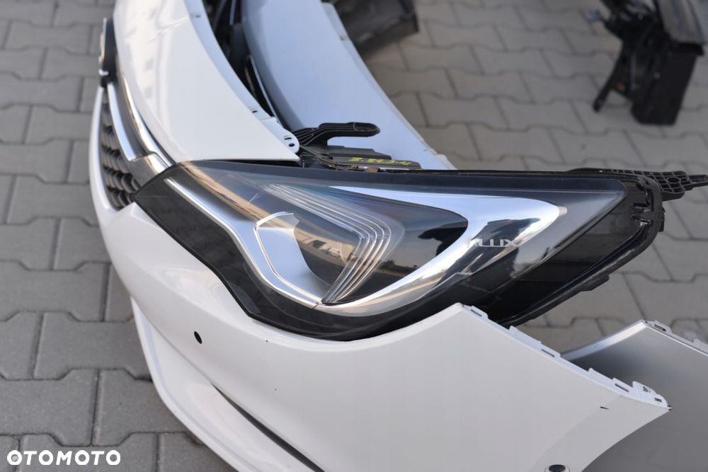 MASKA BŁOTNIK ZDERZAK LAMPA PAS OPEL ASTRA 5 K V - 13