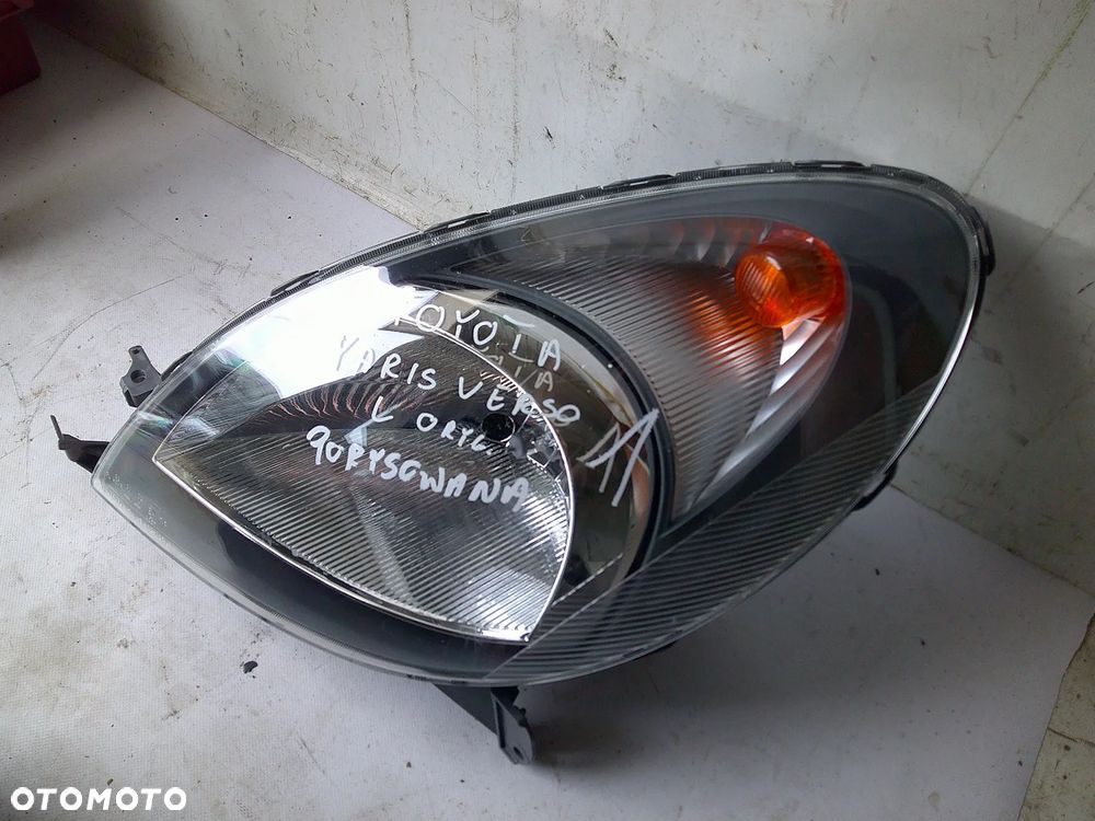 toyota yaris verso lampa przód lewa przednia nowa oryg - 1