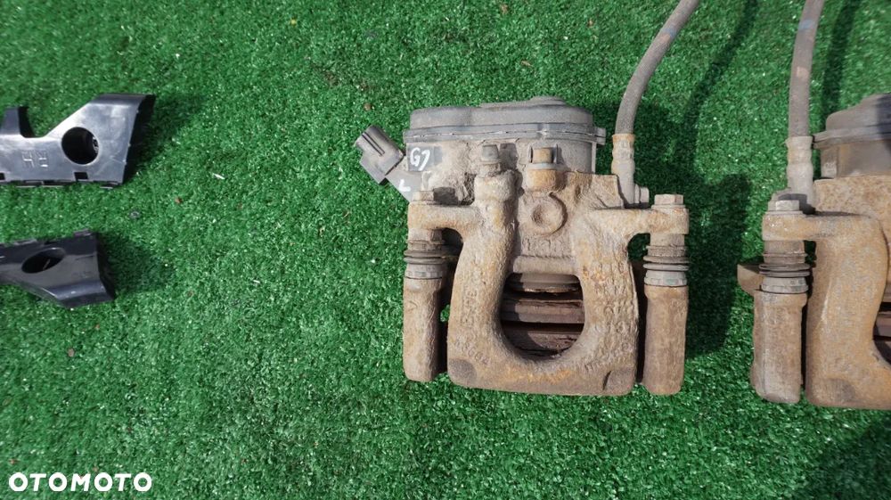 Mazda 6 GJ jarzmo zacisk hamulcowy elektryczny tyl tylny lewy prawy 2015- - 2