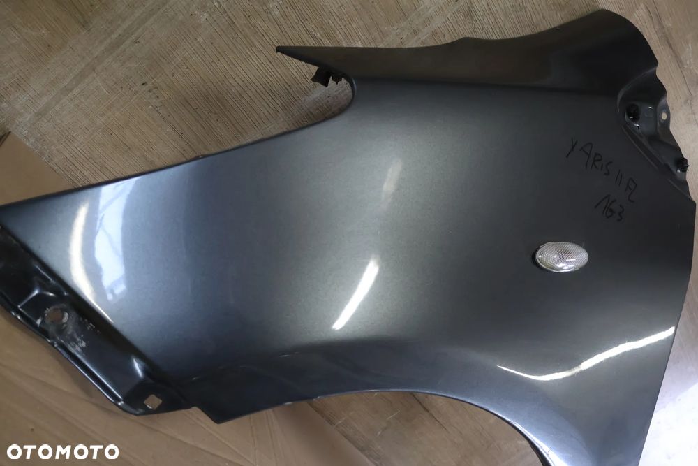 TOYOTA YARIS II 2 LIFT 09-11 BŁOTNIK LEWY PRZÓD PRZEDNI 1G3 - 4