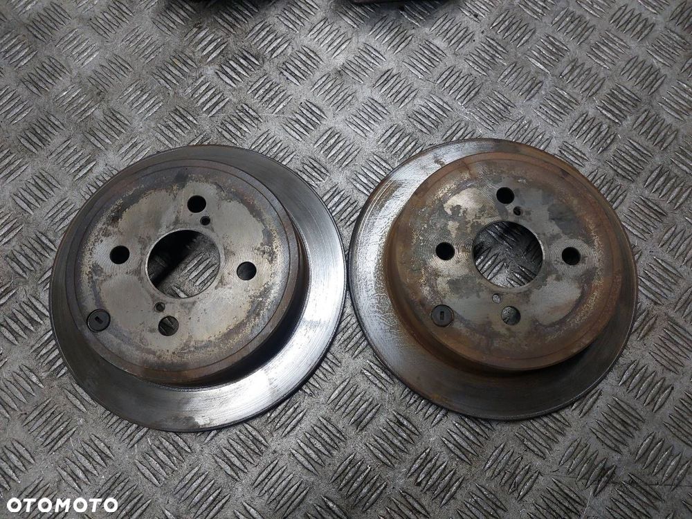 TARCZE HAMULCOWE TYŁ + ZACISKI TOYOTA COROLLA E12 1.6 16V - 2