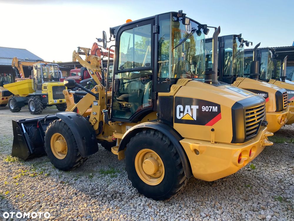 Caterpillar CAT 907M, 3400 MTH, ŁYŻKA OTWIERANA + WIDŁY, z NIEMIEC, SUPER STAN, - 3