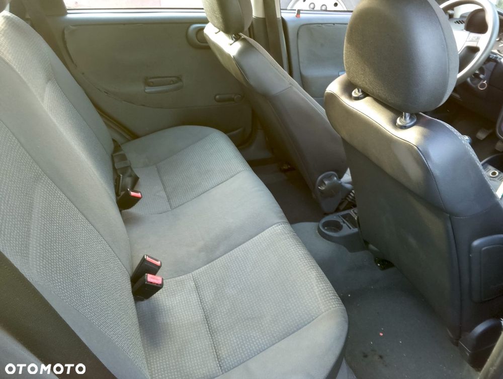 Opel Corsa C (02r.) 1.2 B 74KM. Silnik Z12XE Skrzynia F13BY lakier 20U.Cały na części. GWARANCJA !!! Przód Tył Zestaw Komplet Drzwi Klapa Zderzak Błotnik Maska Grill Atrapa Szyba Pas Lampa Lusterko Boczki Fotel Kanapa Kokpit Deska Rozdzielcza Przełącznik Włącznik Sterownik Przewody Wiązka Instalacja Moduł Komputer Czujnik Listwa Pompa Alternator Wtryski Głowica Rozrusznik Kompresor Sprzęgło Dwumas Silnik Skrzynia ABS Klimatyzacji Paliwa Wspomagania Kolektor Turbina Przepustnica Zawór Chłodnica Koło Hak Belka Sanki Zawieszenie Mcpherson Półoś Amortyzator Wydech Tłumik Zacisk Most - 10