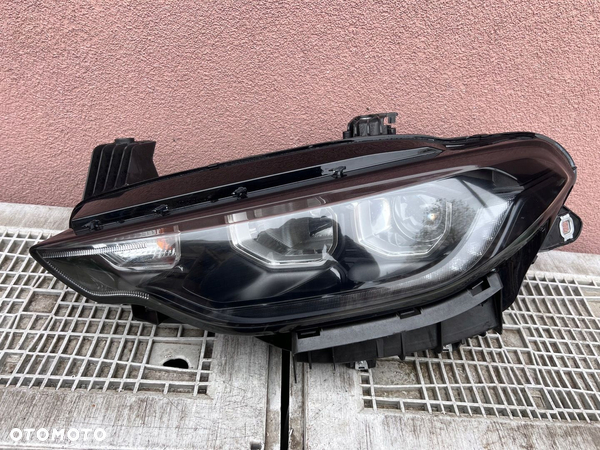 Lampa przednia FIAT TIPO II SOCZEWKA LED CZARNA LEWA EUROPA ORYGINALNA AL