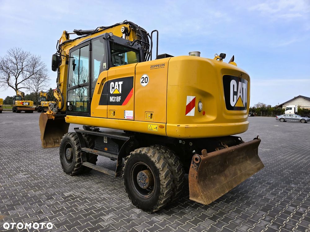 Caterpillar M 318F / z Niemiec /  9300 mth / - 3