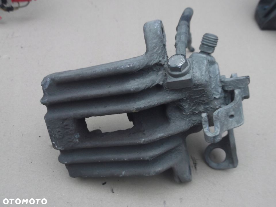 VW POLO III 6N LIFT ZACISK HAMULCOWY LEWY TYŁ EURO - 1