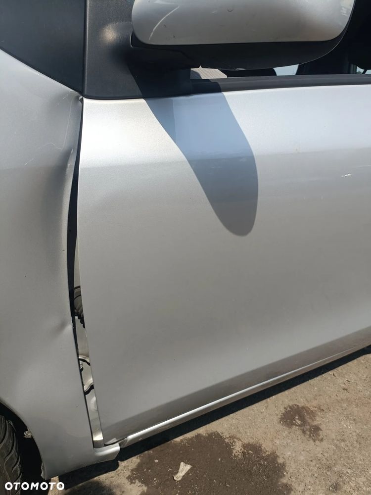 TOYOTA YARIS II 05-11 LIFT 2009 r. 1E7 5D HB drzwi lewy przód LP srebrne * - 2
