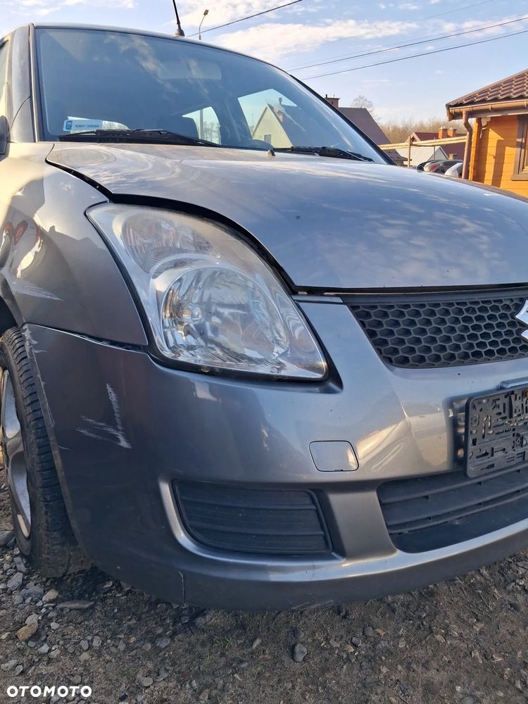 Suzuki Swift 05 zderzak przod ZCD - 2