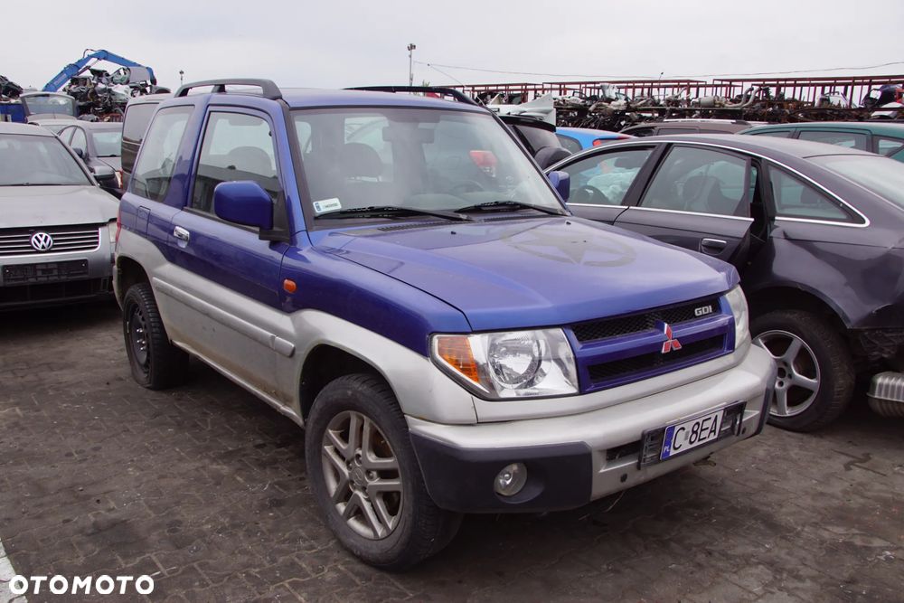 Auto na części - Mitsubishi Pajero Pinin 2.0 GDI 129 KM 4G94 V5M21 TH9B 2003R Silnik Skrzynia Drzwi Maska Błotnik Klapa Zderzak Lampa Lusterko Klamka Szyba Deska Kokpit Sterownik Moduł Czujnik Licznik Wyświetlacz Panel Kierownica - 1