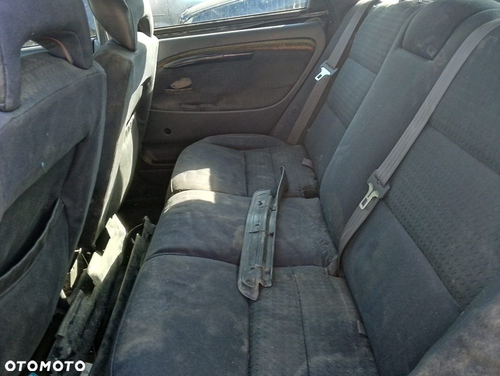 Volvo V40 I FL (99-04r.) 1.8 B 122KM. Silnik B4184S2 Skrzynia M5P lakier BLACK METALIC.Cały na części. GWARANCJA !!!  Przód Tył Zestaw Komplet Drzwi Klapa Zderzak Błotnik Maska Grill Atrapa Szyba Pas Lampa Lusterko Boczki Fotel Kanapa Kokpit Deska Rozdzielcza Przełącznik Włącznik Sterownik Przewody Wiązka Instalacja Moduł Komputer Czujnik Listwa Pompa Alternator Wtryski Głowica Rozrusznik Kompresor Sprzęgło Dwumas Silnik Skrzynia ABS Klimatyzacji Paliwa Wspomagania Kolektor Turbina Przepustnica Zawór Chłodnica Koło Hak Belka Sanki Zawieszenie Mcpherson Półoś Amortyzator Wydech Tłumik Zacisk Most - 8