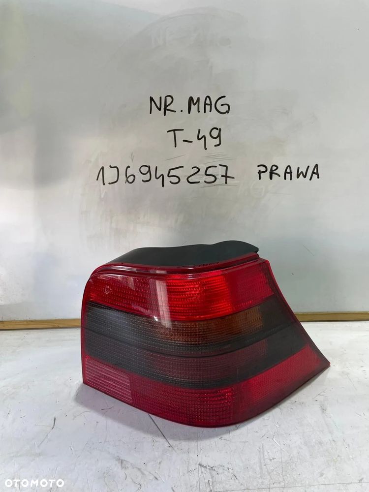 LAMPA LEWA TYŁ TYLNA DYMIONA CIEMNA VW GOLF IV 1J6945257 - 1