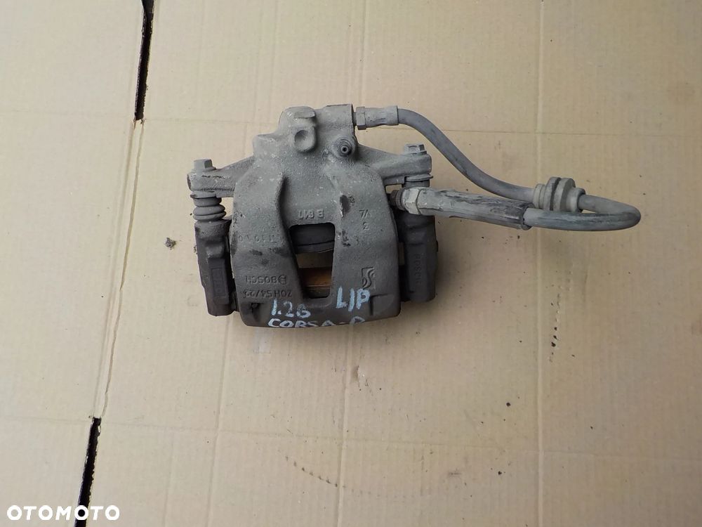 zacisk hamulcowy lewy przód opel corsa d 1,2 16v 2010r - 1