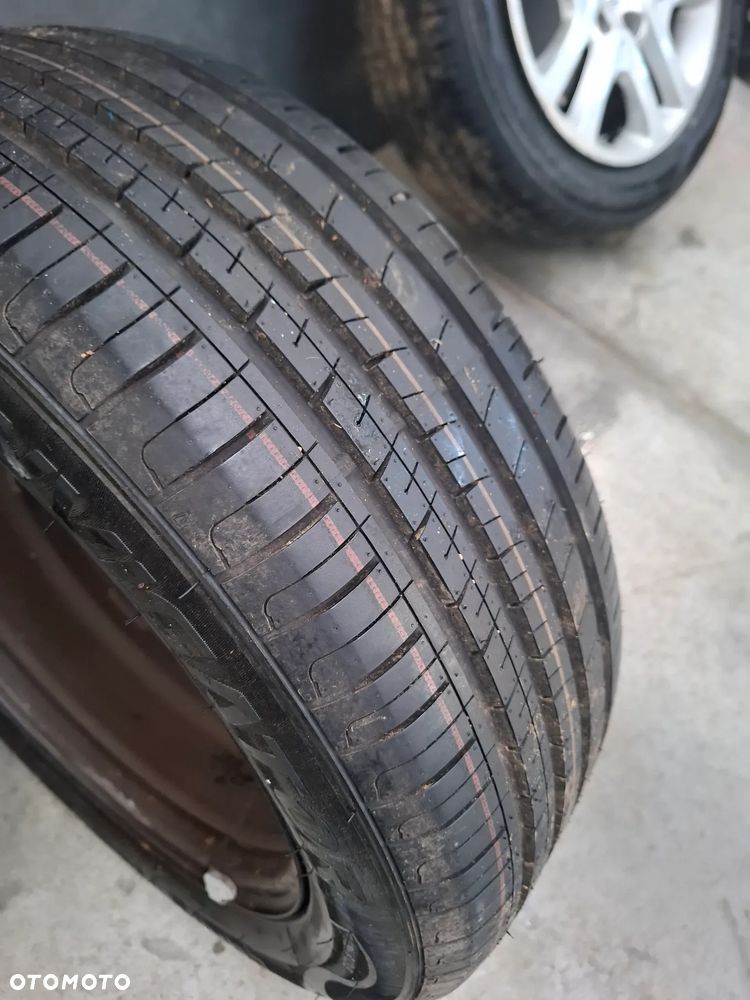 Felgi z kołpakami nowe opony Opel Astra K 5x105 - 7