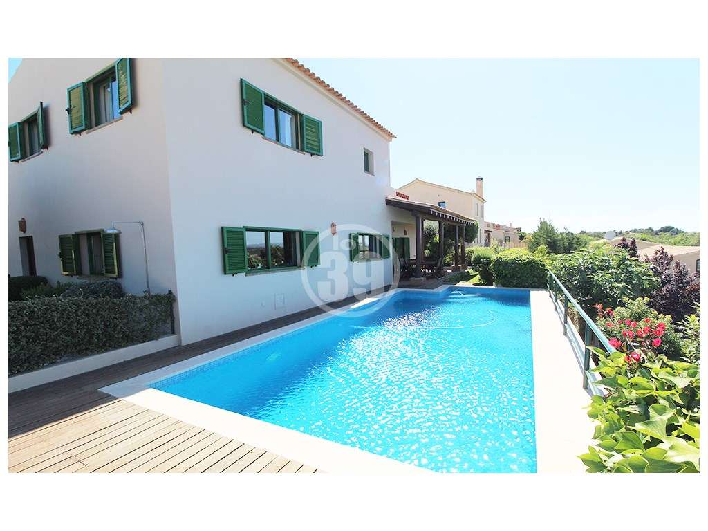 Moradia T4 com Piscina, Jardim e Vistas Panorâmicas no Centro de Algoz - Grande imagem: 4/49