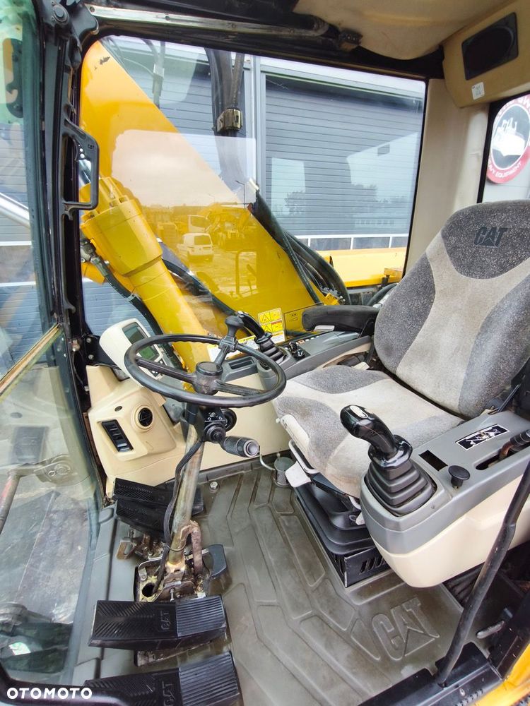 Caterpillar M316C - 12