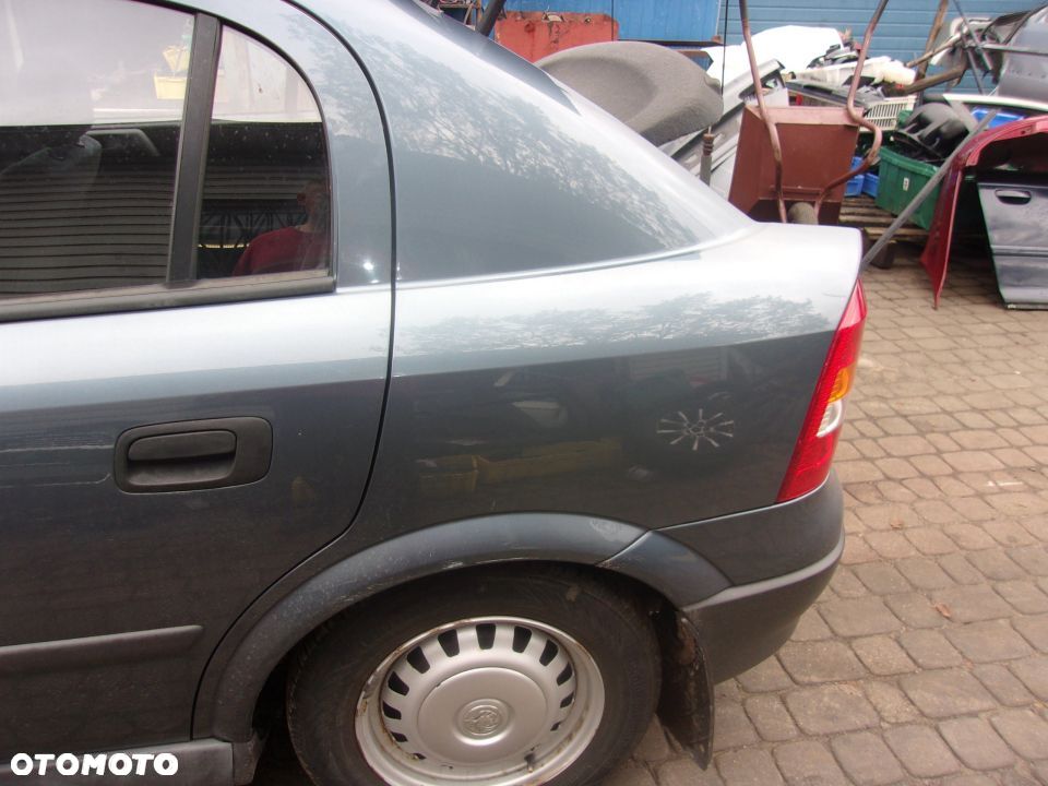 BŁOTNIK TYLNY LEWY LUB PRAWY OPEL ASTRA II G 5D - 2