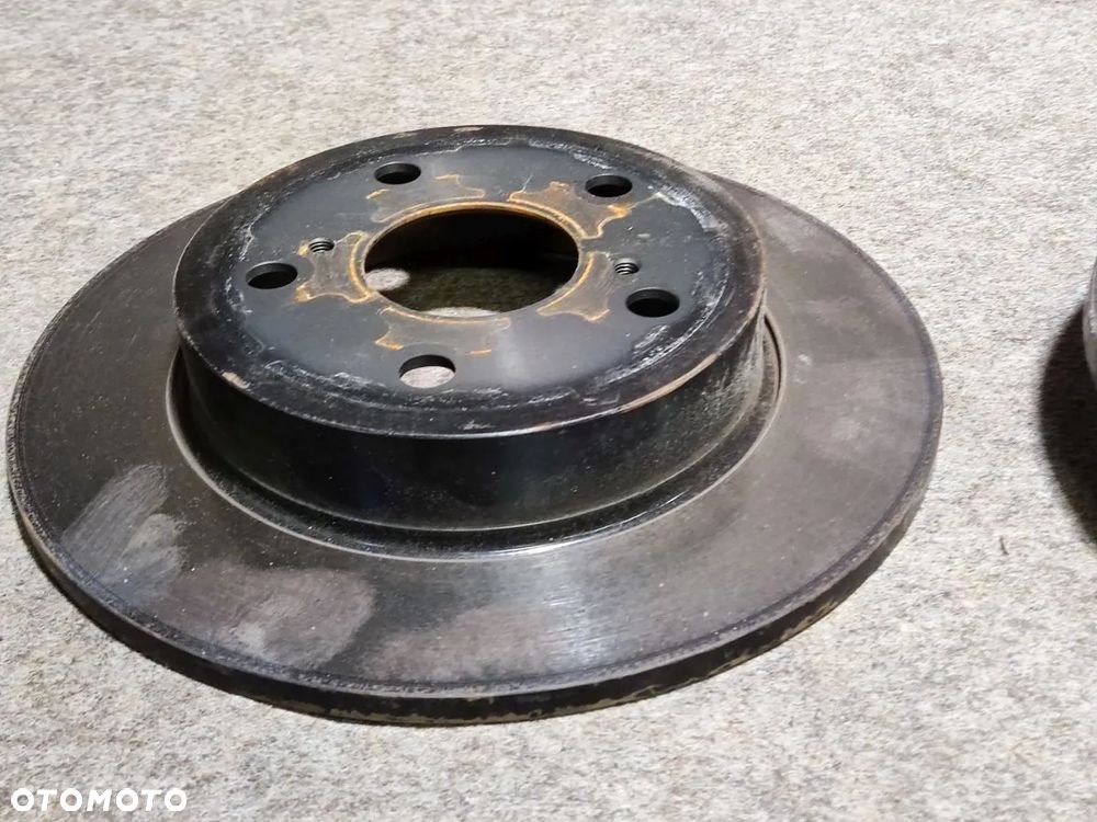 TOYOTA COROLLA E21 1.8h od 2023r Tarcza Hamulcowa Tył - 2