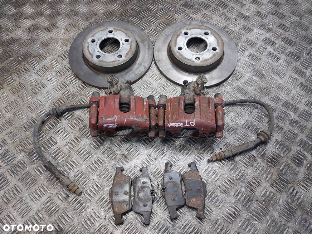 TARCZE HAMULCOWE TYŁ + KLOCKI + ZACISKI FORD C-MAX I MK1 - 1