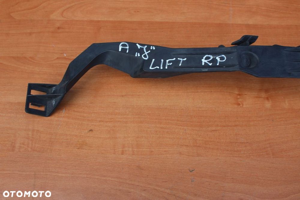 ŚLIZG WSPORNIK MOCOWANIE PODSTAWA LAMPY PRAWY OPEL ASTRA IV LIFTING  13368882 - 2