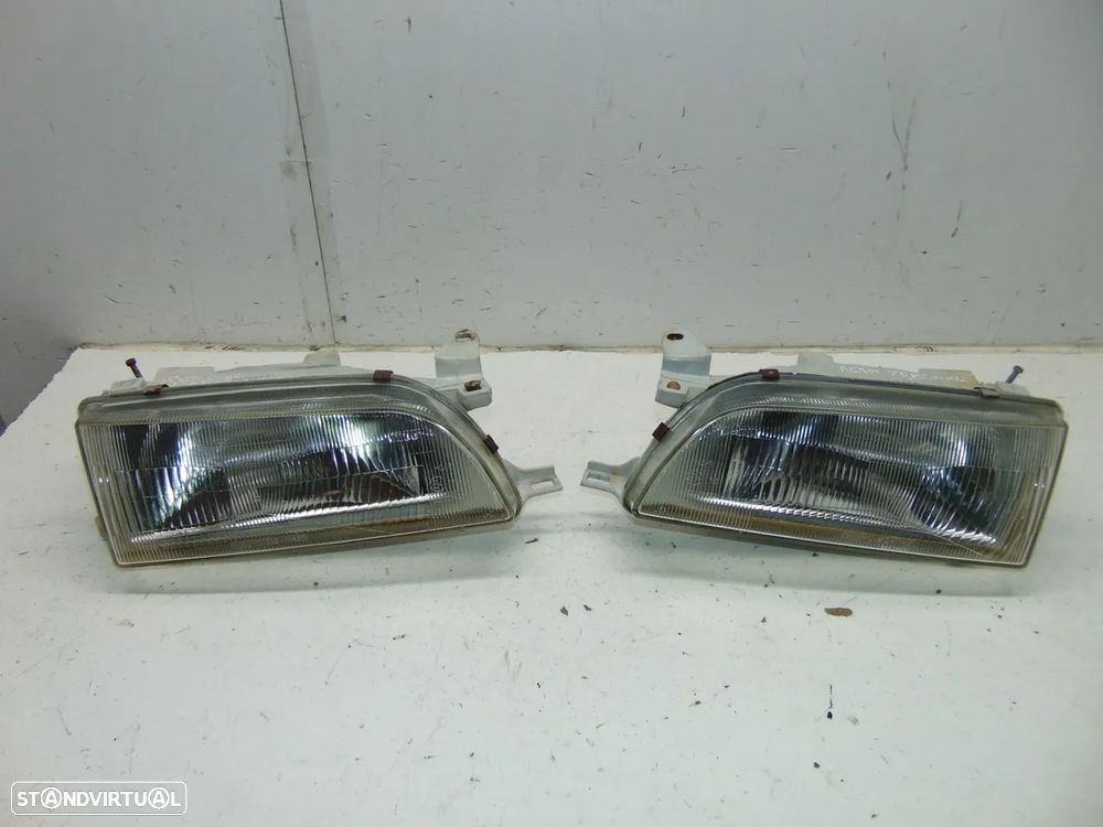 Toyota Corolla AE100 E10 faróis - 1