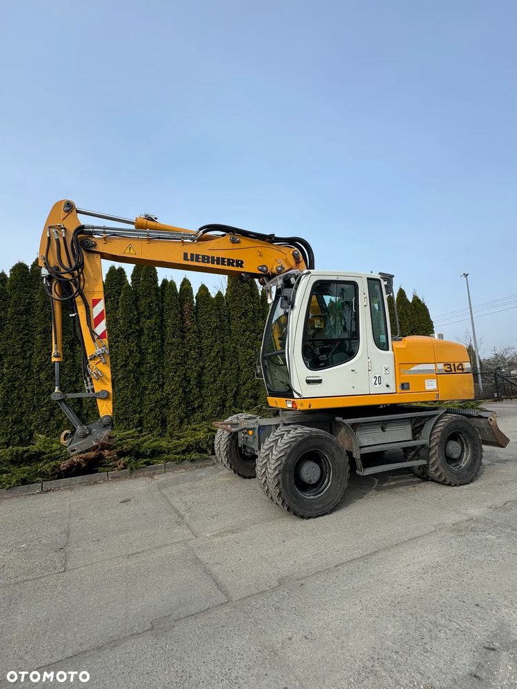 Liebherr 314 Litronic Rotator - 1