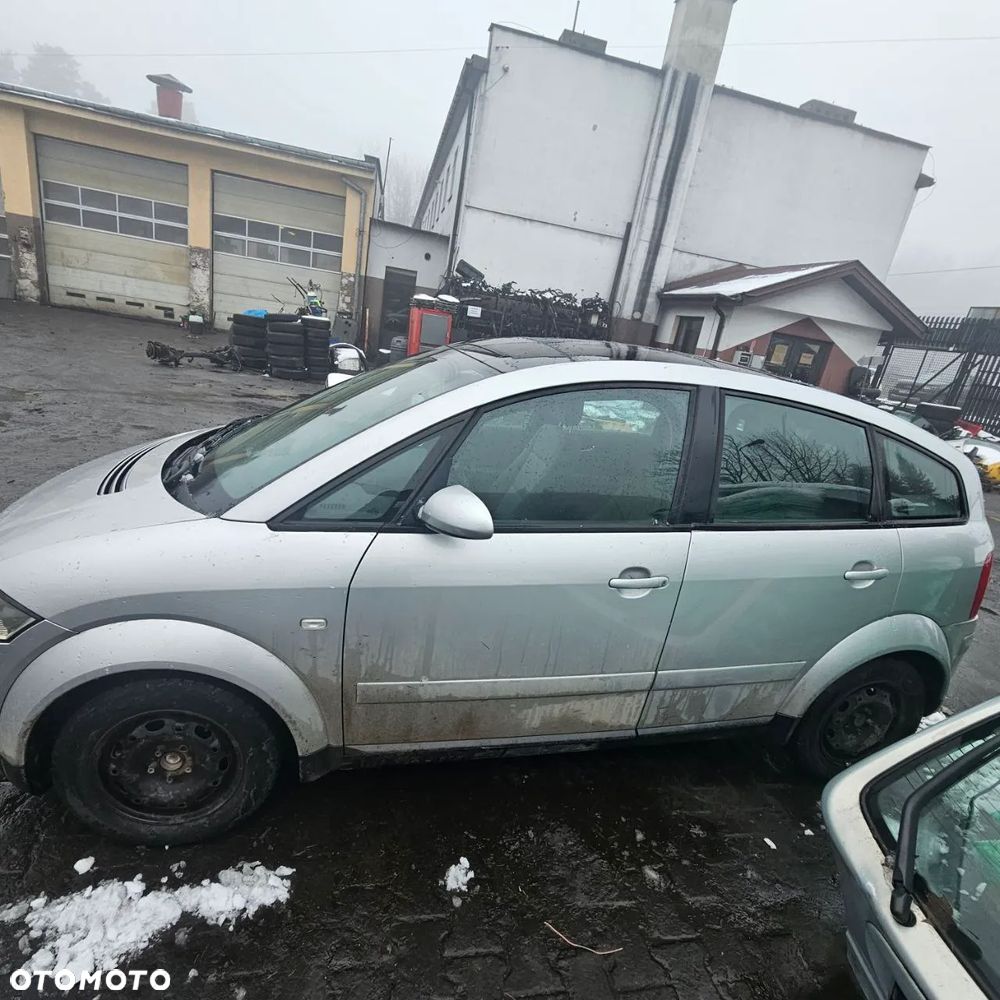 AUDI A2 (lak: LY7W) (sedan) pojazd na części: maska, zderzak, drzwi, szyby, lusterka, chłodnica - 1