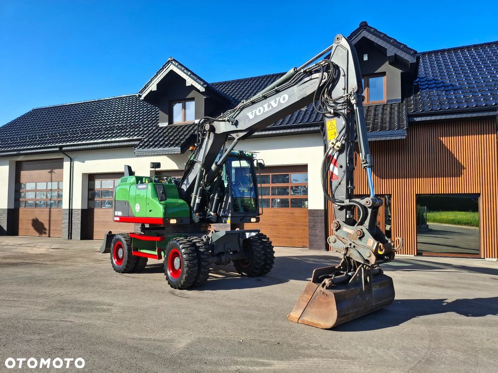 Volvo EW 140D Koparka Kołowa OilQuick Szybkozłącze Podwójne Koła 2015 Rok 2439 MTH Moc: 204 KM Dodatkowa Łyżka Pług Bardzo Dobry Stan Sprowadzona - 23