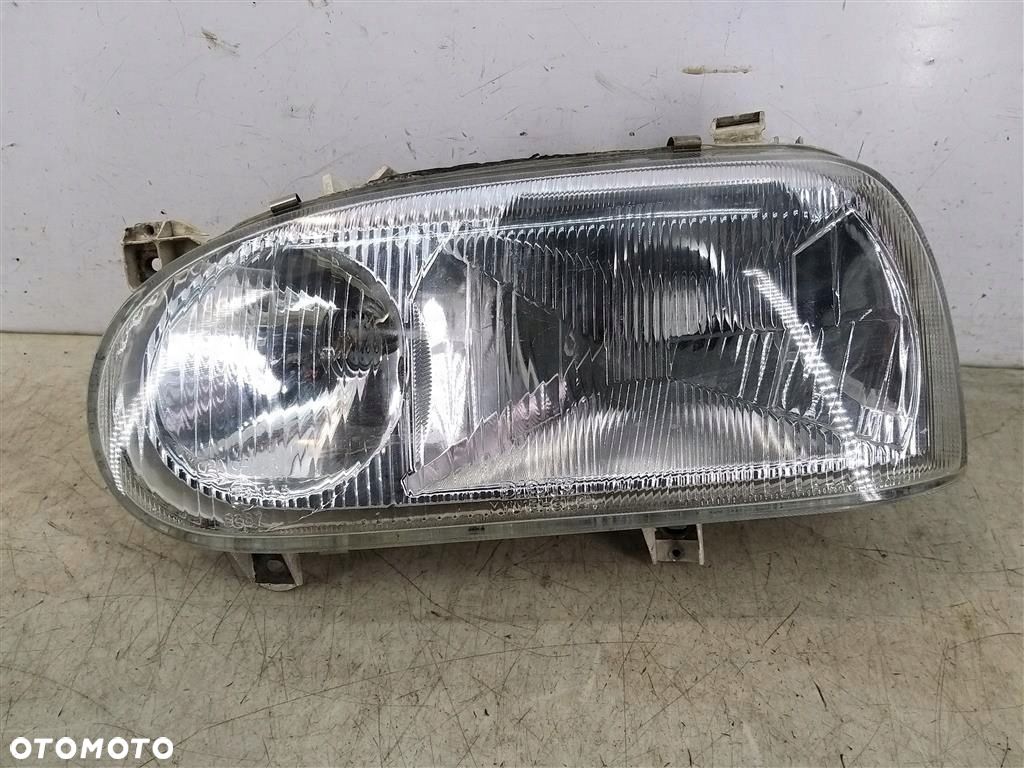 Reflektor lampa przód lewa VW Golf III 1991-1998 HELLA 139173-00L ORYGINAŁ - 1