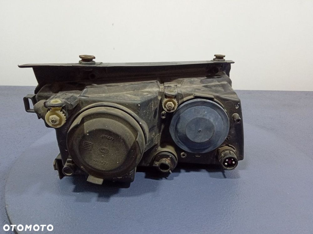VW PASSAT B5 96-00 REFLEKTOR LEWY H7 EU 147425-00 - 2