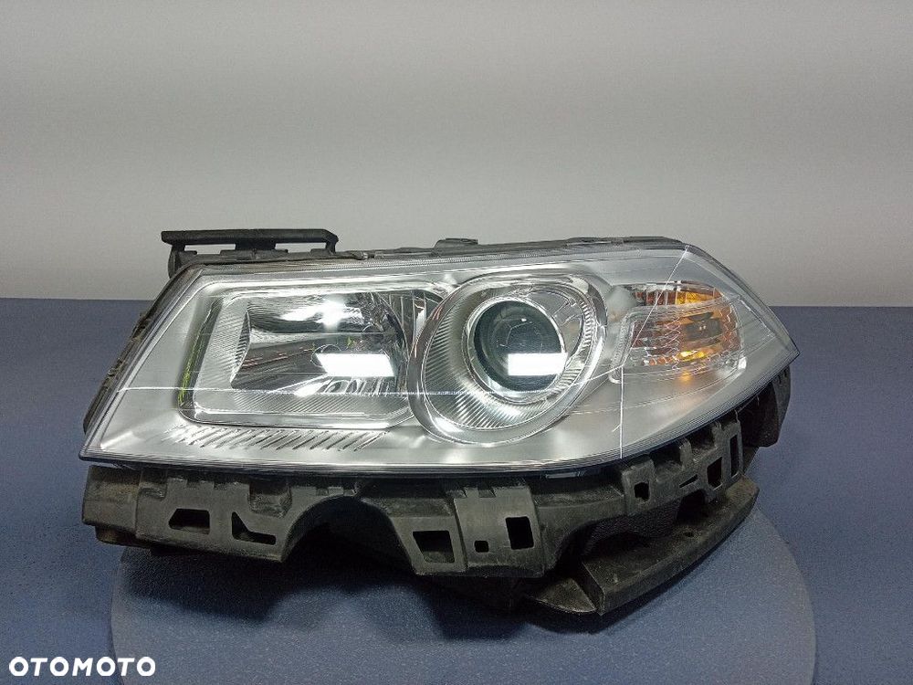 RENAULT MEGANE II LIFT 06- REFLEKTOR LEWY SOCZEWKA EU 89312739 - 1