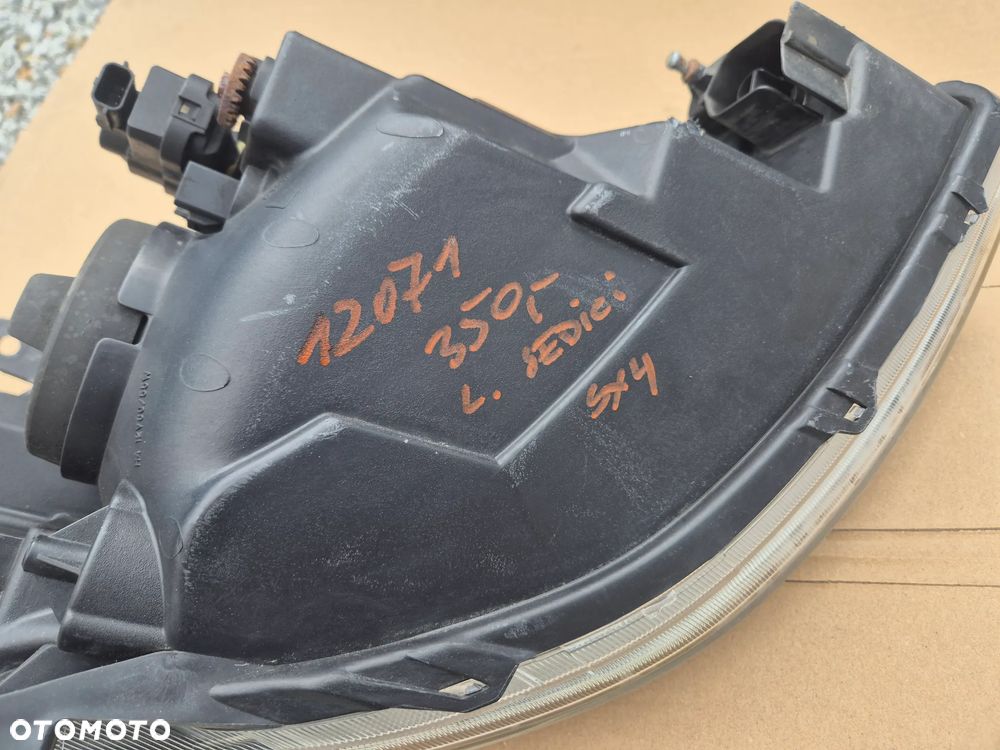 Fiat Sedici Suzuki SX 4 lampa lewa.Oryginał.EU. - 12