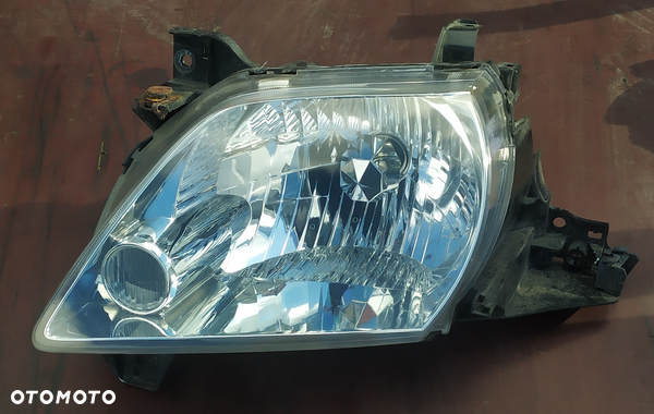Lampa przednia lewa Mazda MPV / Stanley P2018