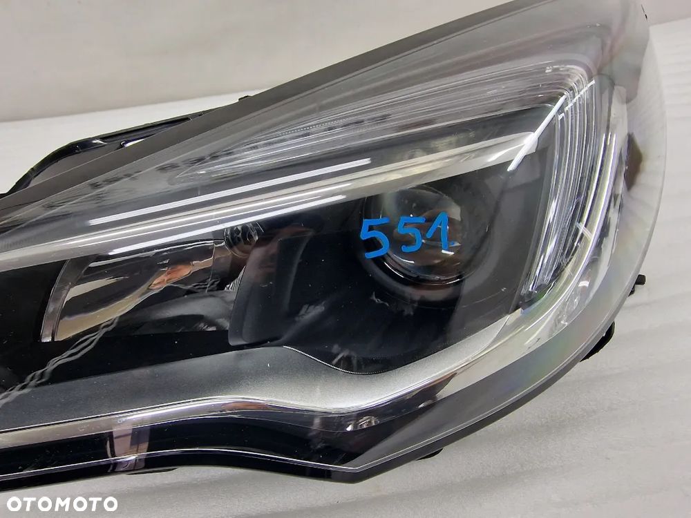 OPEL ASTRA V K 5 15- LEWA SOCZEWKA ZWYKŁA NR 39077800 , NR AUKCJI LL551 - 5