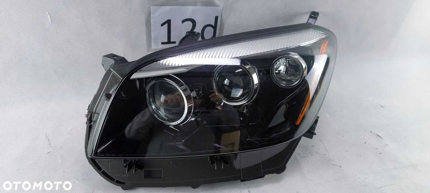 TOYOTA RAV4 EV 2012 2013 2014 REFLEKTOR LEWY LAMPA KOITO 42-61 USA - 2