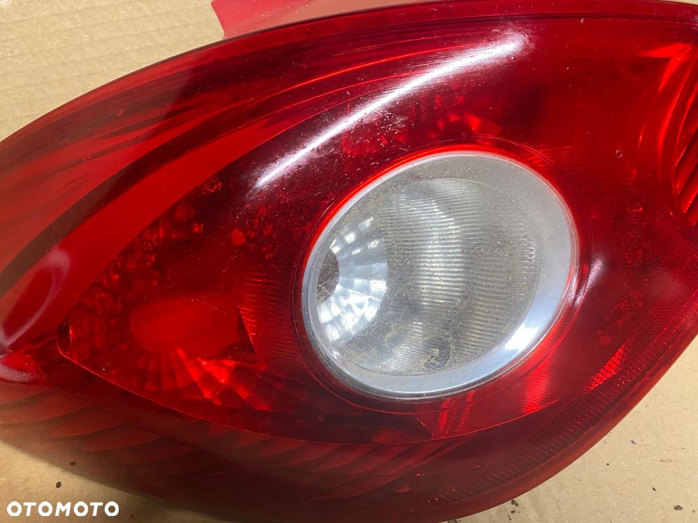 OBUDOWA LAMPA TYLNA LEWA OPEL CORSA D 13186350 - 2