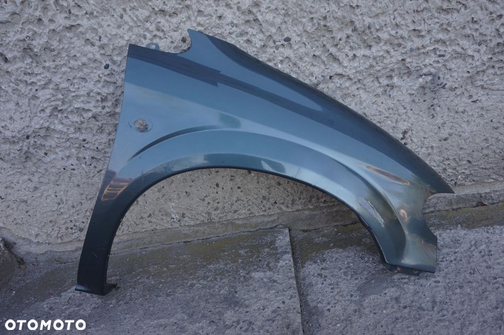 BŁOTNIK PRZEDNI PRAWY GRAND VOYAGER IV