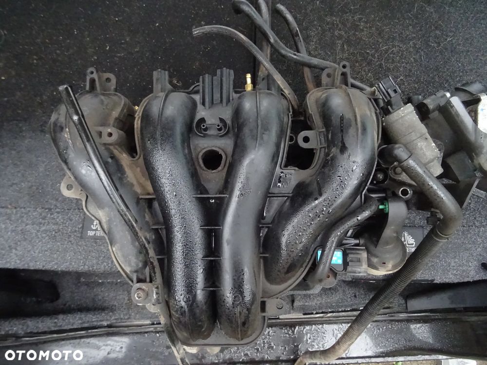 WYPRZEDAZ FORD MAVERICK MAZDA TRIBUTE 2,3 150KM TRIBUTE KOLEKTOR SSACY ORYGINal czesci