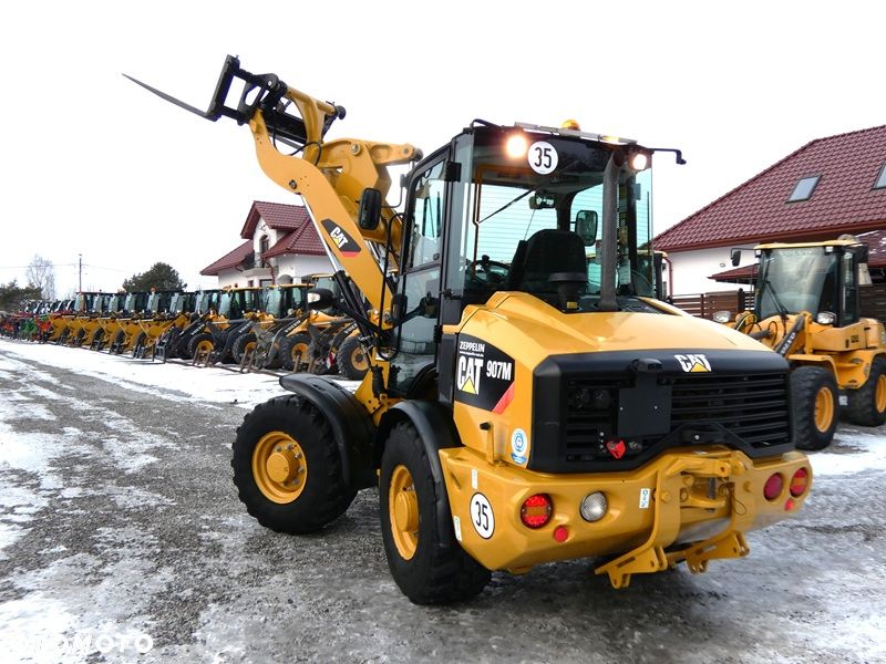 Caterpillar CAT 907M Z Niemiec / Wyjątkowo Wyposażony / 35km/h / 3.050mtg / - 37