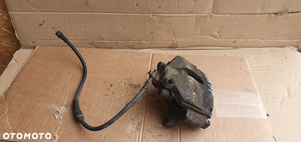 Zacisk hamulcowy prawy przód VW Passat B6 - 1